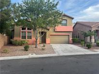 Charming two-story home with desert landscaping, covered porch, and two-car garage at 5861 Varese Dr, Las Vegas, NV 89141