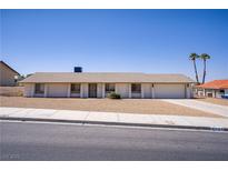 Charming single-story home with desert landscaping and attached two-car garage at 6727 E Washington Ave, Las Vegas, NV 89110