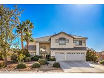 Charming two-story home with well-manicured landscaping and a three-car garage at 6971 Cedar Basin Ave, Las Vegas, NV 89142