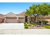 Charming single-story home featuring a three-car garage and stone accents at 2164 Noonday Ct, Henderson, NV 89052