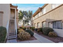 A well-maintained condo building with lush landscaping and pedestrian-friendly sidewalks at 3400 Cabana Dr # 2010, Las Vegas, NV 89122