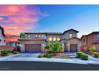 Elegant two-story home showcasing a well-maintained front yard, two-car garage, and stone accents at 362 Port Reggio St, Las Vegas, NV 89138