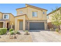 Attractive two-story home with stone accents, a two-car garage, and low-maintenance landscaping at 4519 Stardusk Falls Ave, North Las Vegas, NV 89084