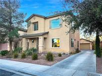 Charming two-story home with a well-maintained front yard and a private detached garage at 6437 Boatbill St, North Las Vegas, NV 89084