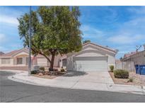 Charming single-story home featuring a two-car garage, desert landscaping, and a mature shade tree at 6624 Old Oxford Ave, Las Vegas, NV 89108