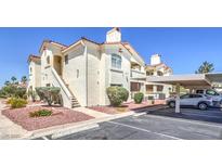 Charming condo complex with stucco walls, red tile roofs, and covered parking in a well-maintained community at 698 S Racetrack Rd # 1014, Henderson, NV 89015