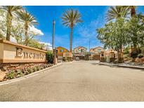 Gated community entrance with sign and landscaping provides security and aesthetic appeal at 7083 Somera Way, Las Vegas, NV 89113