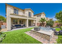 Inviting backyard featuring a spa, patio, well-manicured landscaping, and outdoor seating at 7424 Rainford St, Las Vegas, NV 89148