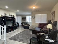 Cozy living room featuring plush gray carpet and ample seating at 933 Kimbark Ave, Las Vegas, NV 89148