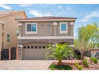 Two-story home boasts a neutral color palette and stone accents at 9807 Panther Hollow St, Las Vegas, NV 89141