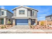 Charming two-story home with a two-car garage and low maintenance landscaping at 1027 Gentle Swan St # 689, Henderson, NV 89011