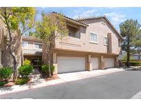 Two-story home with a three-car garage and well-maintained landscaping, providing curb appeal at 2152 Jasper Bluff St # 103, Las Vegas, NV 89117