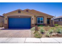 Charming single-story home with a well-manicured yard and a two-car garage at 2169 Rio Rancho Pointe Pl, Henderson, NV 89002