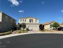 Charming two-story home featuring neutral paint, well-manicured landscaping, and a two-car garage at 2620 Tolmezzo St, Henderson, NV 89044