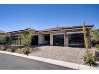 Beautiful single-story home featuring a three-car garage and desert landscaping at 47 Garibaldi Way, Henderson, NV 89011