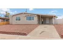 Charming single-story home with a covered parking area and low-maintenance landscaping at 49 Constitution Ave, Henderson, NV 89015
