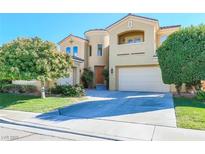 Charming two-story home with a well-manicured lawn and an attached two-car garage at 5043 Gable Crest Ct, Las Vegas, NV 89141