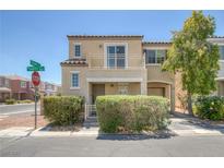 Inviting two-story home with a balcony, attached garage, and manicured landscaping at 6217 Lapilli Ave, Las Vegas, NV 89139
