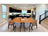 Bright, open-concept dining area featuring modern furnishings and seamlessly connected to the kitchen and living spaces at 8042 Misty Canyon Ave, Las Vegas, NV 89113