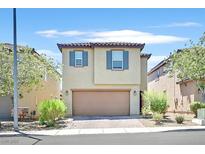 Charming two-story home showcasing a neutral color scheme, complemented by a well-maintained front yard and a two car garage at 8755 Spanish Ridge Ave, Las Vegas, NV 89148
