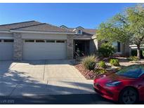 Charming single story home featuring a stone accented facade, manicured landscaping and a spacious driveway at 10816 Elm Ridge Ave, Las Vegas, NV 89144