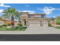 Charming two-story home with a well-maintained front yard and three car garage at 2382 Sunburst View St, Henderson, NV 89052