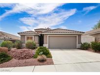 Charming single-story home featuring desert landscaping, neutral tones, and a spacious two-car garage in a quiet neighborhood at 2787 Sunken Ship St, Laughlin, NV 89029