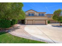 Two-story home with a three-car garage and well-maintained landscaping at 335 Pleasant Summit Dr, Henderson, NV 89012