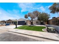 Charming single-story home with well-maintained landscaping and a two-car garage at 3572 Tempe St, Las Vegas, NV 89103