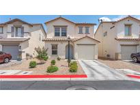 Charming two-story home featuring a desert landscape, attached garage, and inviting front entrance at 4252 Olympic Point Dr, Las Vegas, NV 89129
