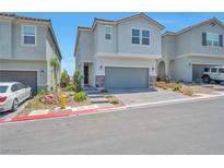Charming two-story home featuring an attached garage and nicely paved driveway at 5398 Robinera Ct, Las Vegas, NV 89166