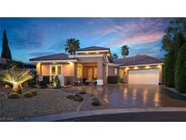 Charming single-story home boasting a tile roof, desert landscaping, and an attached garage at 5416 Alabaster Ct, Las Vegas, NV 89149