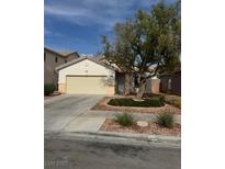 Charming single-story home featuring a well-maintained front yard and attached two-car garage at 6022 Highland Gardens Dr, North Las Vegas, NV 89031