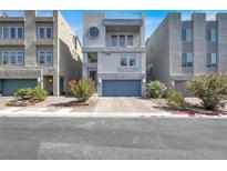 Modern three-story townhome with unique round window and well maintained landscaping at 8060 Haywood Estate Ave, Las Vegas, NV 89113