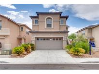 Charming two-story home with a two-car garage, desert landscaping, and inviting curb appeal at 8745 Dodds Canyon St, Las Vegas, NV 89131