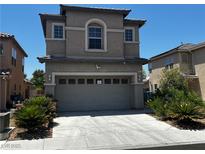 Two story home featuring desert landscaping and a two car garage at 8745 Dodds Canyon St, Las Vegas, NV 89131