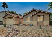 Charming single-story home with desert landscaping, a detached garage, and a welcoming exterior at 10712 Aire Dr, Las Vegas, NV 89144