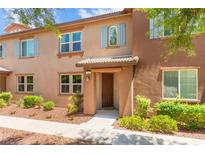 Charming townhome with a well-maintained front yard and inviting entrance at 11402 Newton Commons Dr # 102, Las Vegas, NV 89135