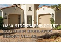 Charming home featuring a brick driveway leading to a two-car garage and landscaped front yard at 11830 Kingsbarns Ct, Las Vegas, NV 89141