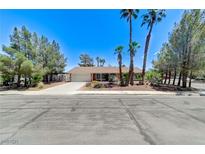 Charming single story home featuring a spacious driveway and xeriscaped front yard at 3360 Paso Andres St, Las Vegas, NV 89146