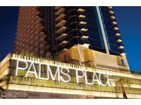 Exterior shot of the Palms Place building at night showcasing its modern design and illuminated signage at 4381 Flamingo Rd # 2612, Las Vegas, NV 89103