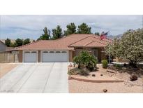 Charming single-story home featuring a spacious driveway and well-maintained desert landscaping at 4650 Stoneham St, Pahrump, NV 89061