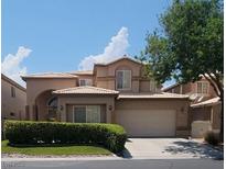 Charming two-story home with a well-manicured lawn and a two-car garage at 5509 Big Sky Ln, Las Vegas, NV 89149