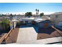 Charming single-story home with well-kept landscaping, solar panels, and a spacious driveway at 5817 Rae Dr, Las Vegas, NV 89108