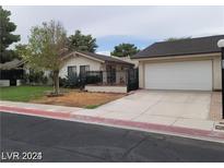 Charming single story home with a two car garage and fenced front yard at 600 Woodmount Dr, Las Vegas, NV 89107