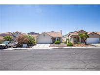 Charming single-story home with a well-maintained front yard and a two-car garage at 8437 Cinnamon Hill Ave, Las Vegas, NV 89129