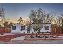 Charming single story home with a desert landscaped front yard and accent lighting at 1731 Sherwin Ln, Las Vegas, NV 89156