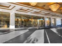 A stunning entrance featuring revolving doors and decorative ceilings with unique lighting fixtures at 2000 N Fashion Show Dr # 5326, Las Vegas, NV 89109