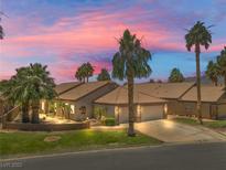 Charming single-story home with desert landscaping and a well-manicured front yard, perfect for curb appeal at 2505 Links Dr, Laughlin, NV 89029
