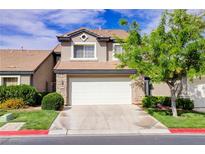 Charming two-story home featuring a two-car garage, well-maintained lawn and stone veneer accents at 602 Painted Cloud Pl, Las Vegas, NV 89144
